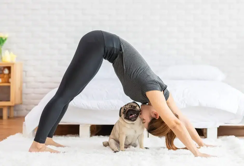 woman doing yoga with her pug